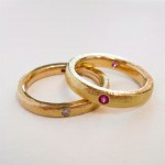 Rubies and diamonds set in 18 kt. gold. Circlet rings