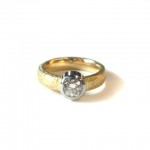 Rose cut diamond set in 19 kt. white gold and 18 kt. yellow gold