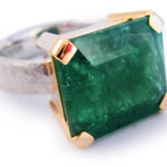 Emerald set in 18 karat gold and sterling silver