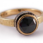 Black rose cut diamond set in 18 kt. gold and sterling silver