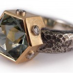 Hexagonal shape mint green tourmaline (cut by Lisa Elser), brilliant cut diamonds set in 18 kt. gold and sterling silver