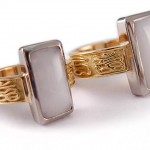 custom designed pair of gold rings with hand cut quartz stones set a white gold bezel