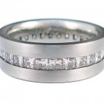 Princess cut Moissanites channel set in 19 kt. white gold ring