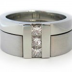 Princess cut diamonds set in 19 kt.. white gold. Two part ring
