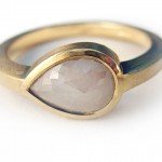 Creamy white rose cut pear shape diamond set in 18 kt. gold ring